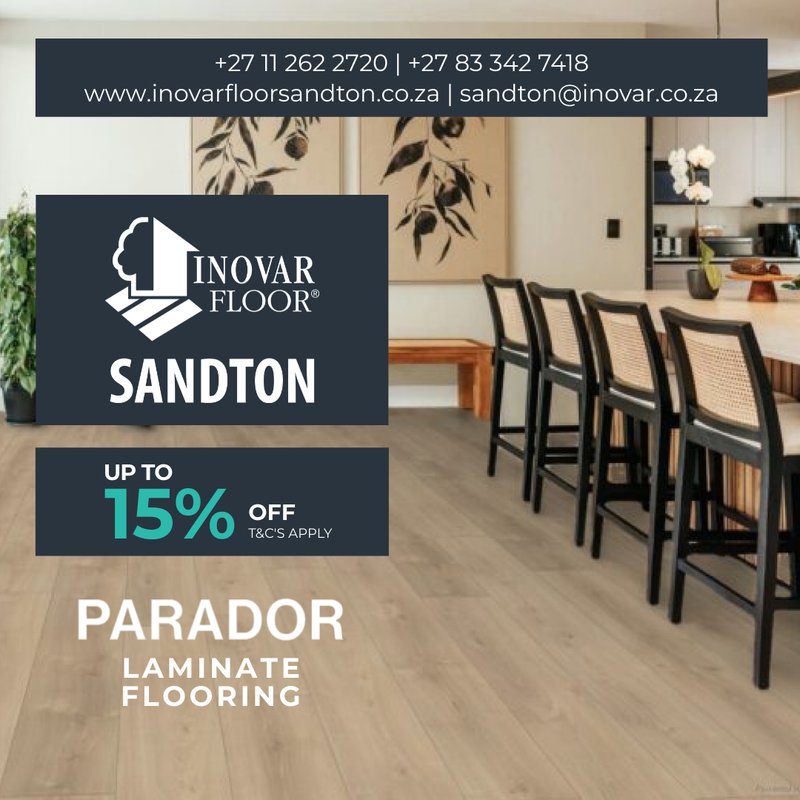 A stylish dining room with natural wood textures and Parador laminate flooring, displaying a 15% discount offer from Inovar Floor Sandton.