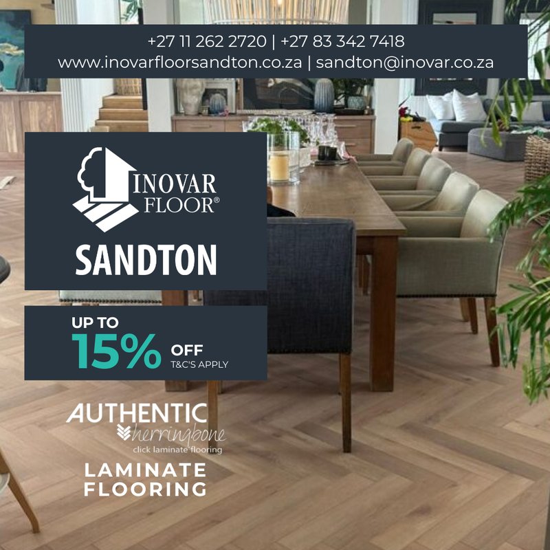 A sophisticated dinning or meeting room featuring Authentic Herringbone laminate fooring with a 15% off discount badge.