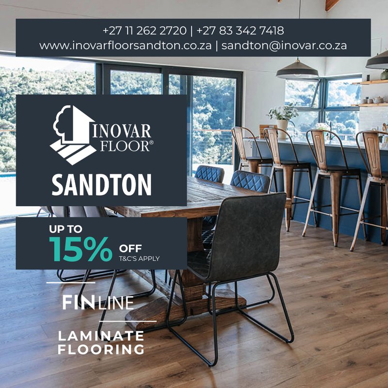 Interior view of a modern open-plan kitchen and dining area featuring dark-toned FINLine laminate flooring with a 15% off promotional overlay.